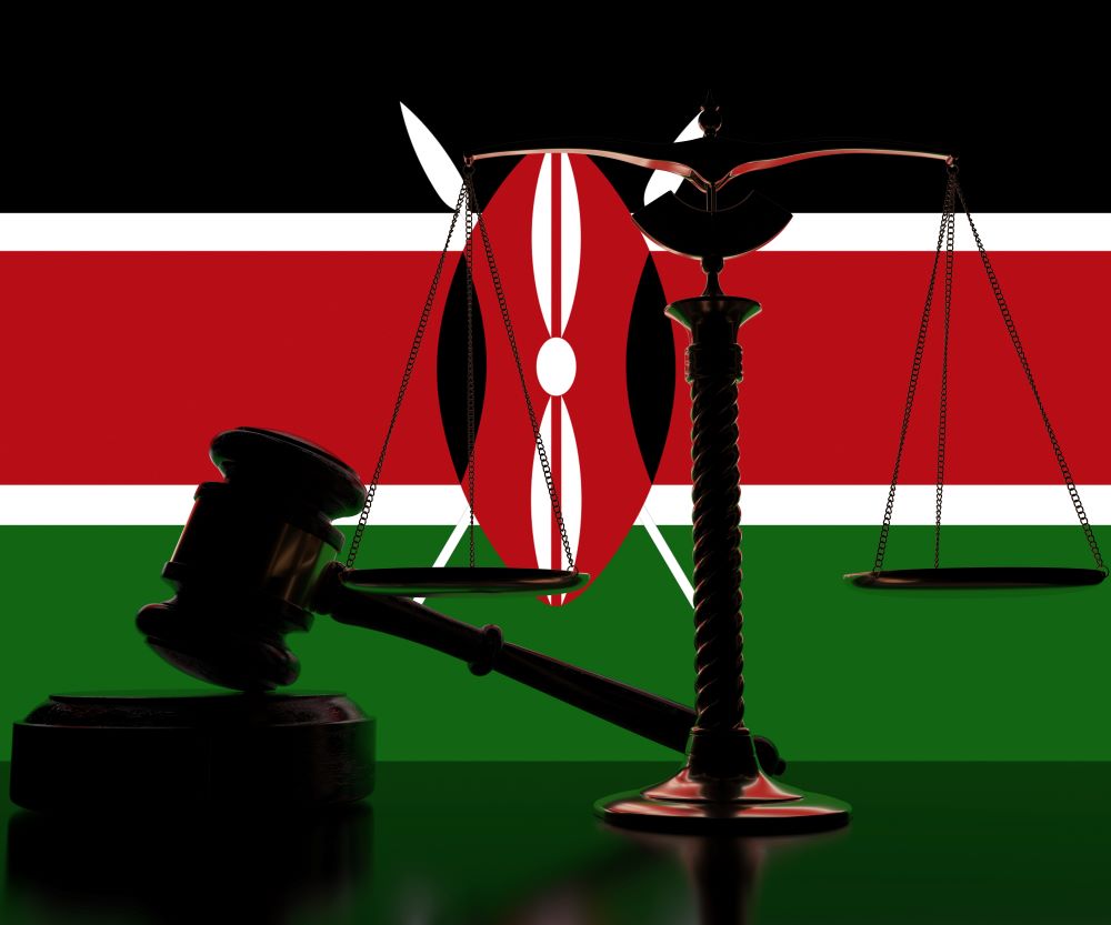 Flag of Kenya behind court gavel and scales